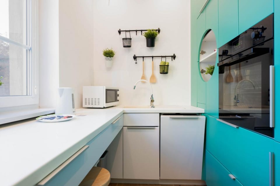 Kitchen or kitchenette, dishwasher, oven, stove