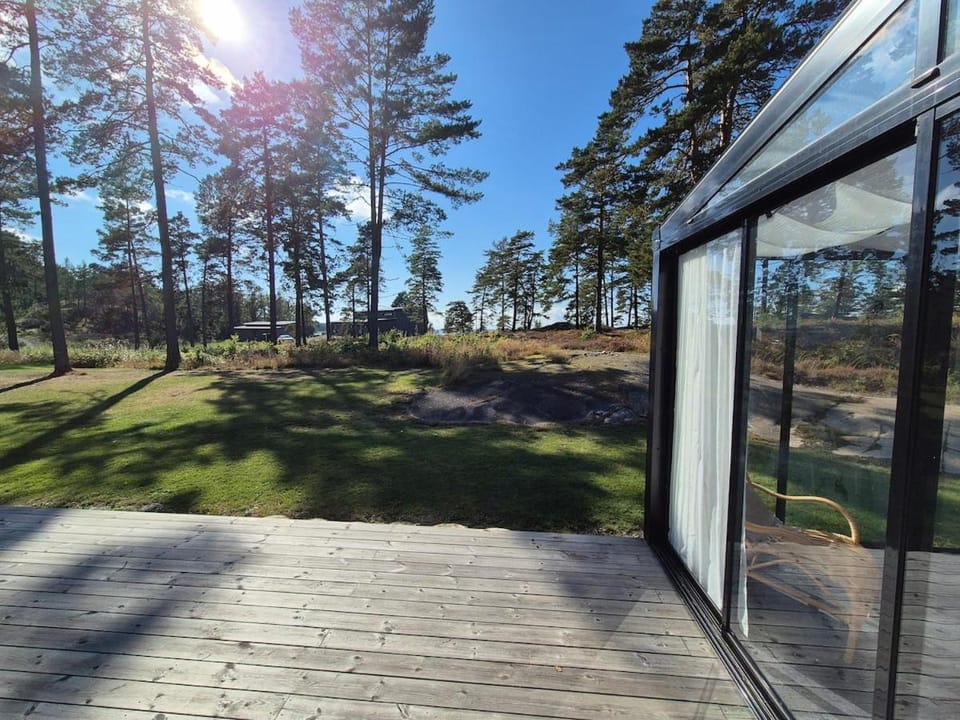 Modern, lakeside cottage with a glimpse of Lake Vänern House in Västra Götaland County