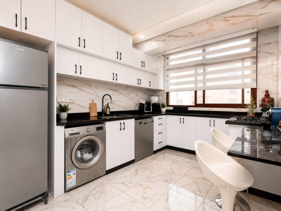 Kitchen or kitchenette, dishwasher, stove, washing machine