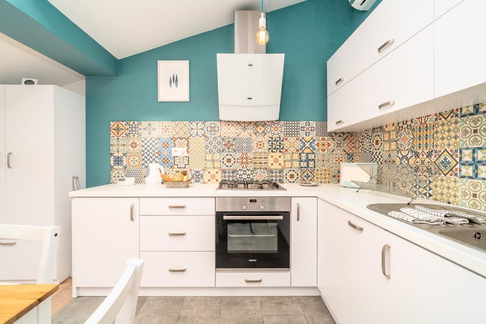Kitchen or kitchenette, dishwasher, oven, stove