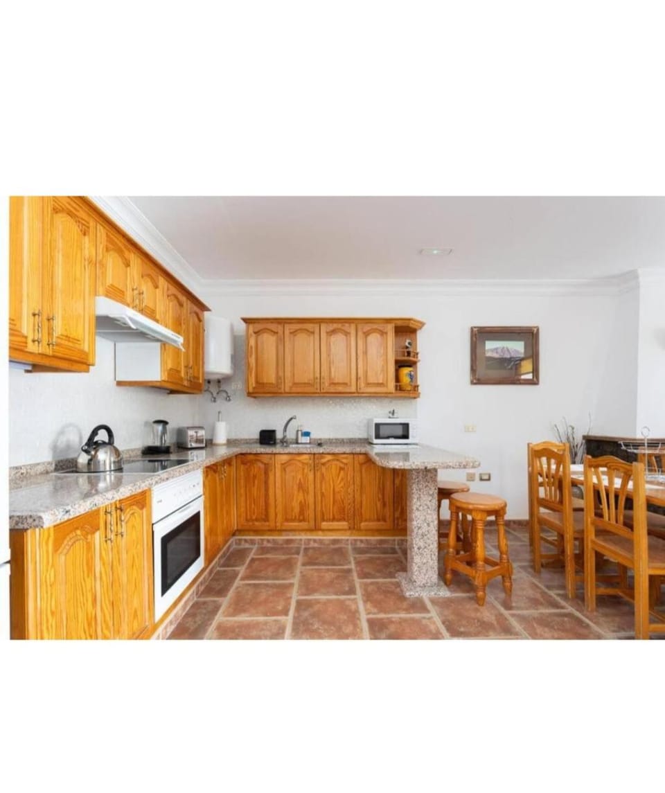 Kitchen or kitchenette, oven, stove, toaster