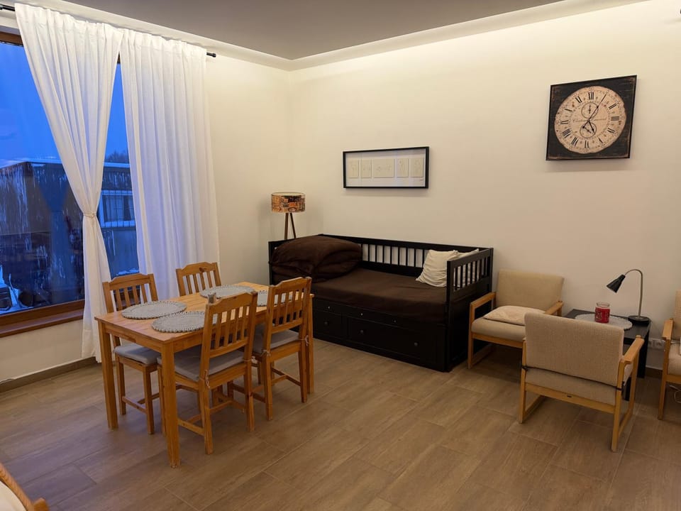 Bed, Living room, Seating area, Dining area