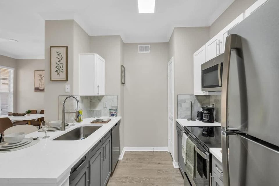 Kitchen or kitchenette, dishwasher, oven, stove