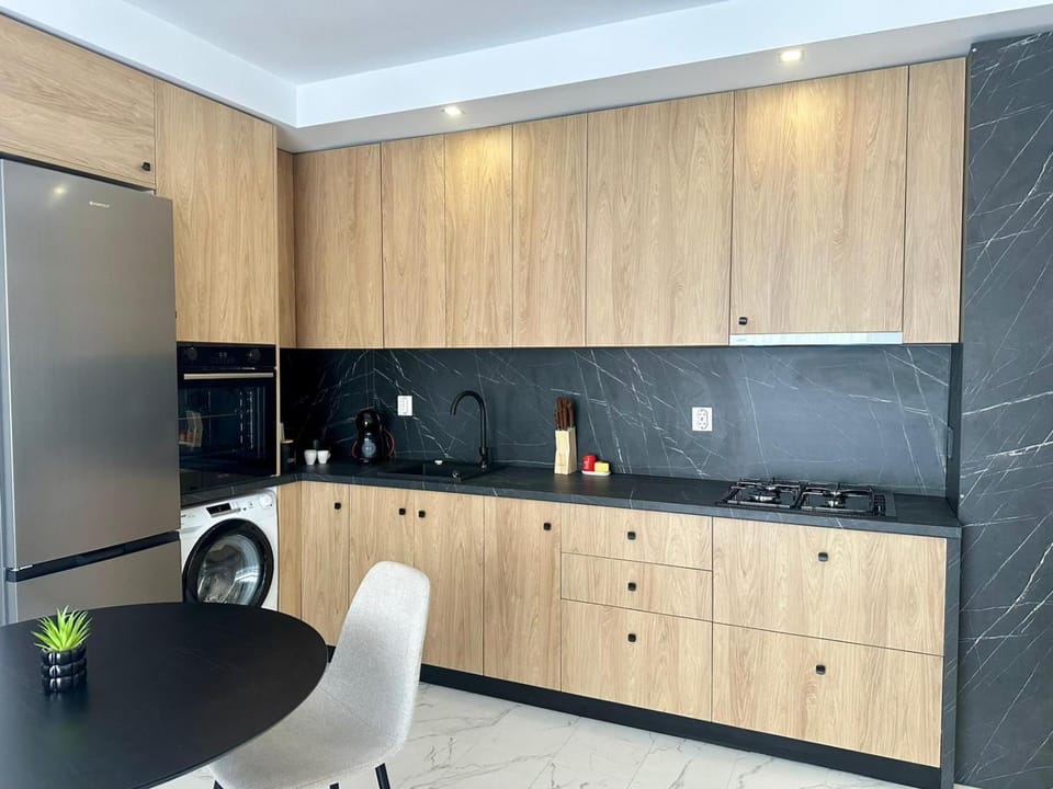Kitchen or kitchenette, oven, stove, washing machine