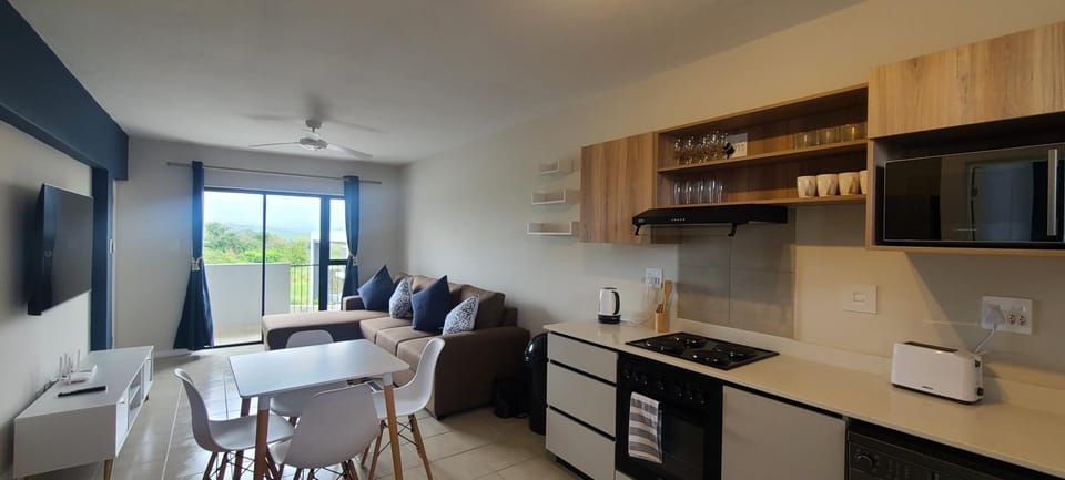 TV and multimedia, Kitchen or kitchenette, Living room, Seating area, Dining area, oven, stove, toaster