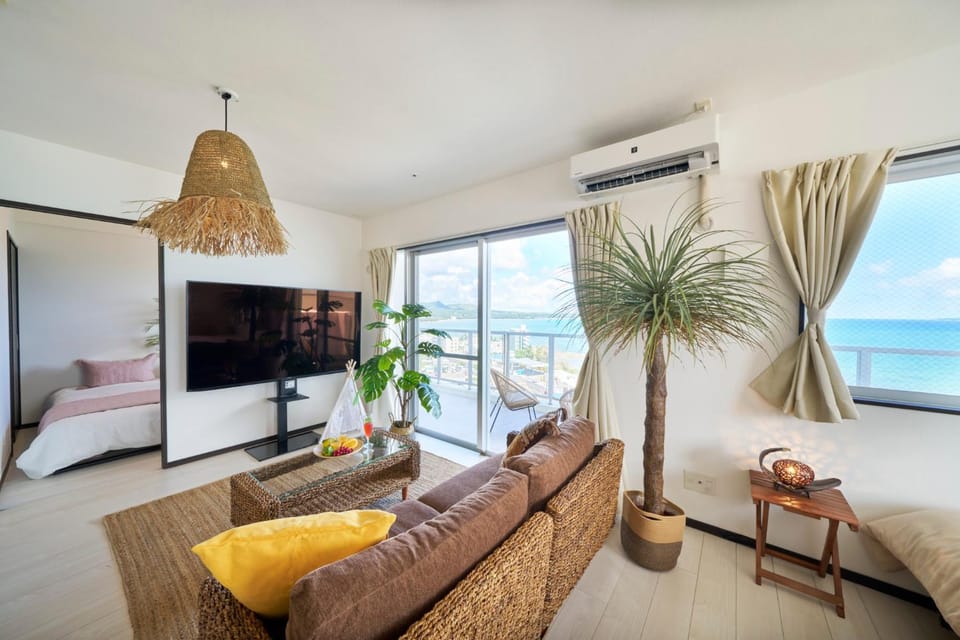 Bed, TV and multimedia, Living room, Seating area, Bedroom, Sea view, air conditioner