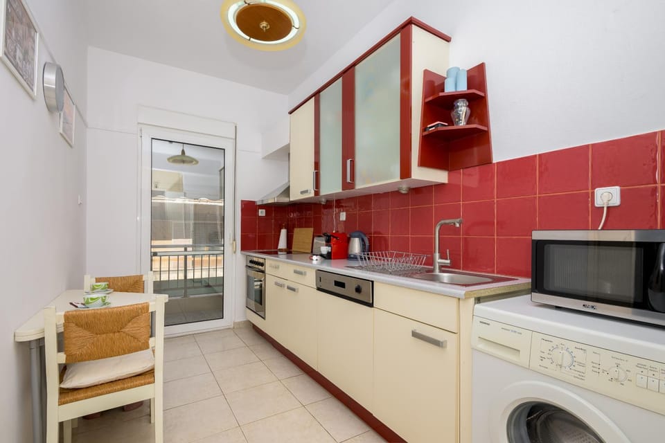 Kitchen or kitchenette, dishwasher, microwave, oven, stove