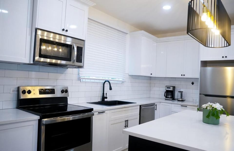 Kitchen or kitchenette, dishwasher, oven, stove