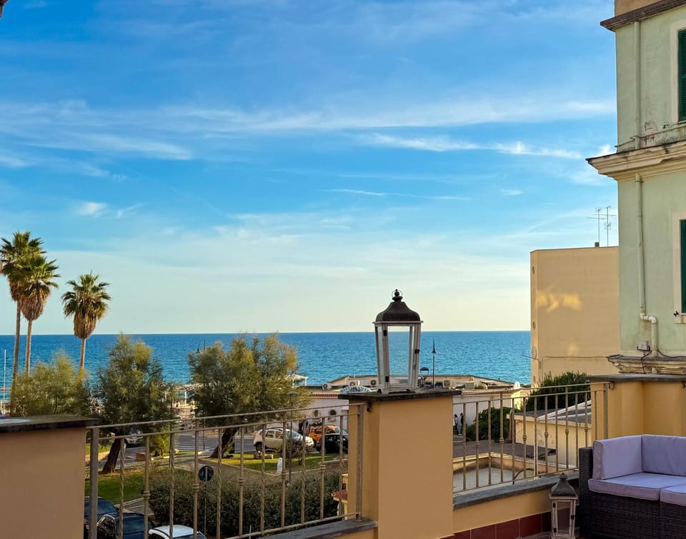 Property building, Patio, Patio, Nearby landmark, Natural landscape, View (from property/room), Balcony/Terrace, Beach, Sea view