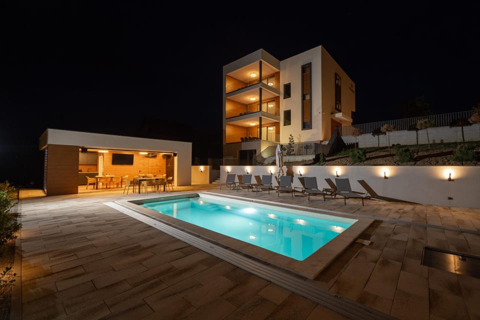 Property building, Night, Pool view, Swimming pool, sunbed