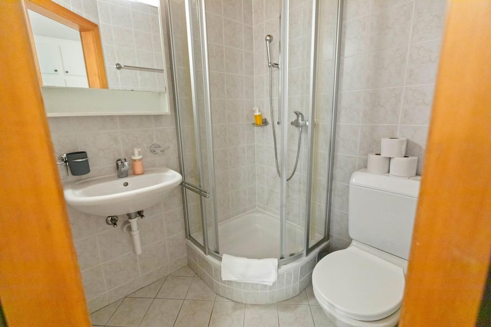 Shower, Toilet, Bathroom, hair dryier, towels