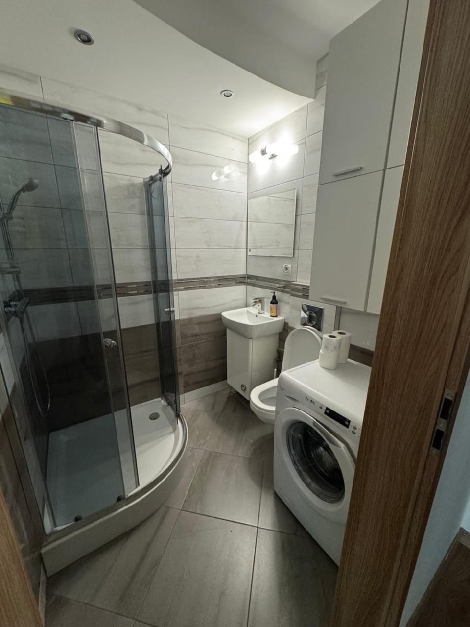 Shower, Toilet, Bathroom, towels, washing machine, dryer