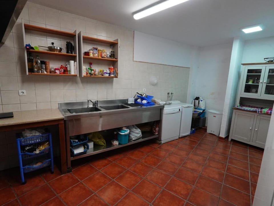 Kitchen or kitchenette, dishwasher, oven, stove