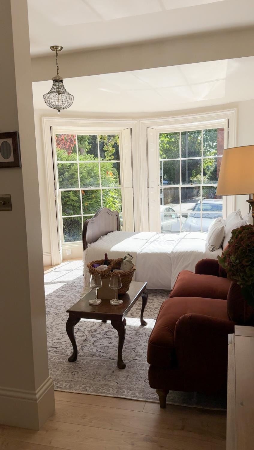 Bed, Living room, Seating area, Bedroom