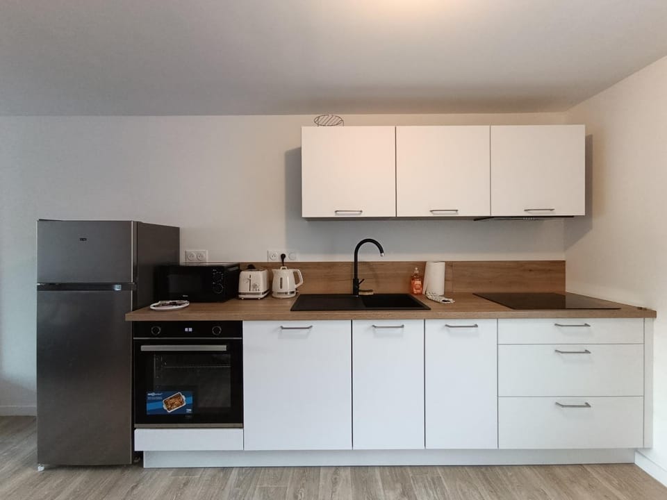 Kitchen or kitchenette, oven, stove, toaster