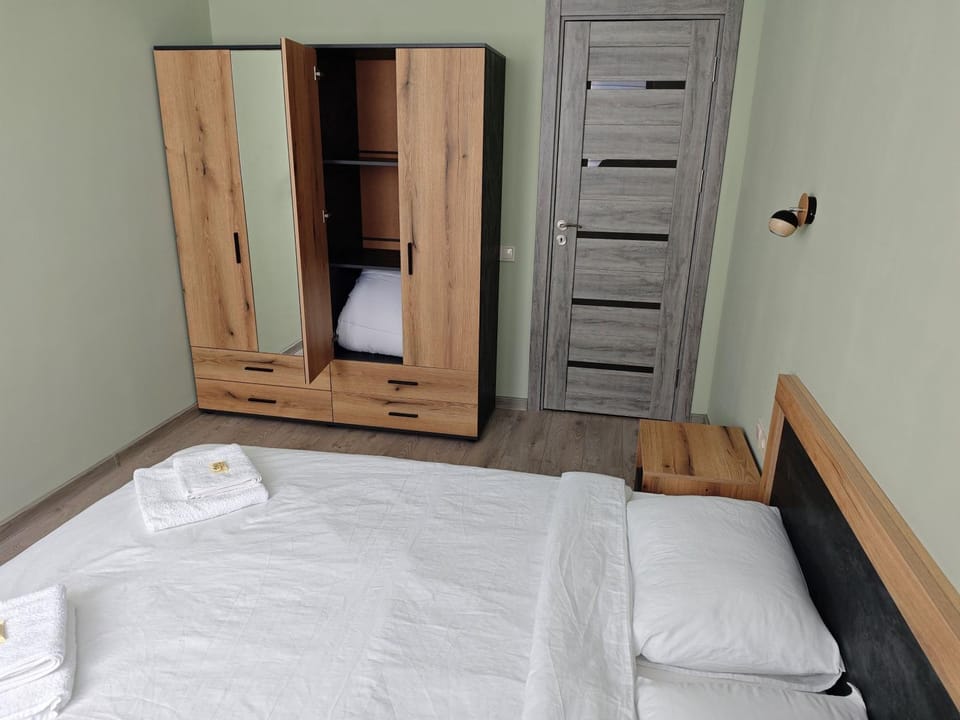 Bed, towels, wardrobe