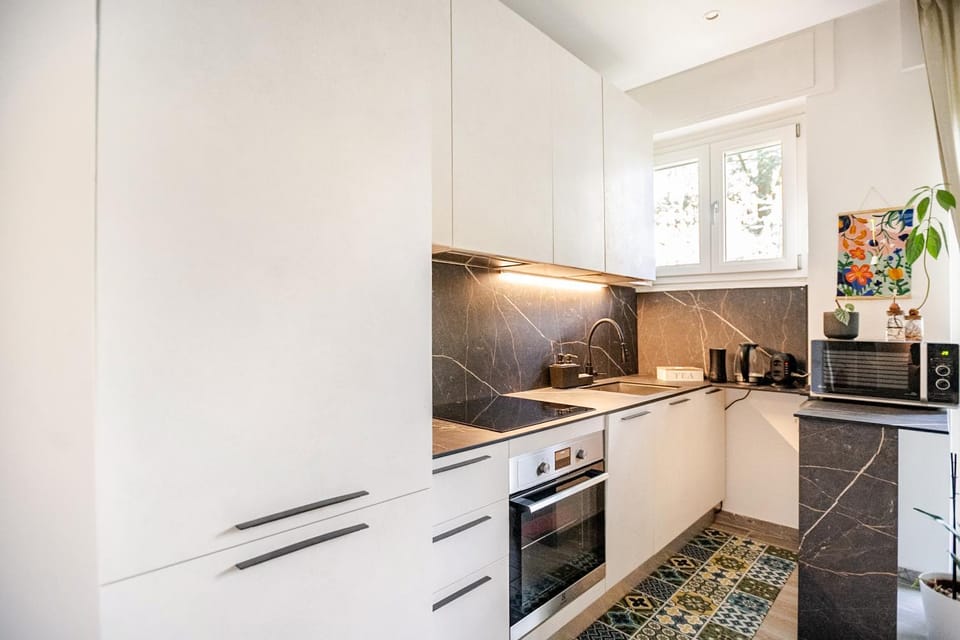Kitchen or kitchenette, dishwasher, microwave, oven, stove
