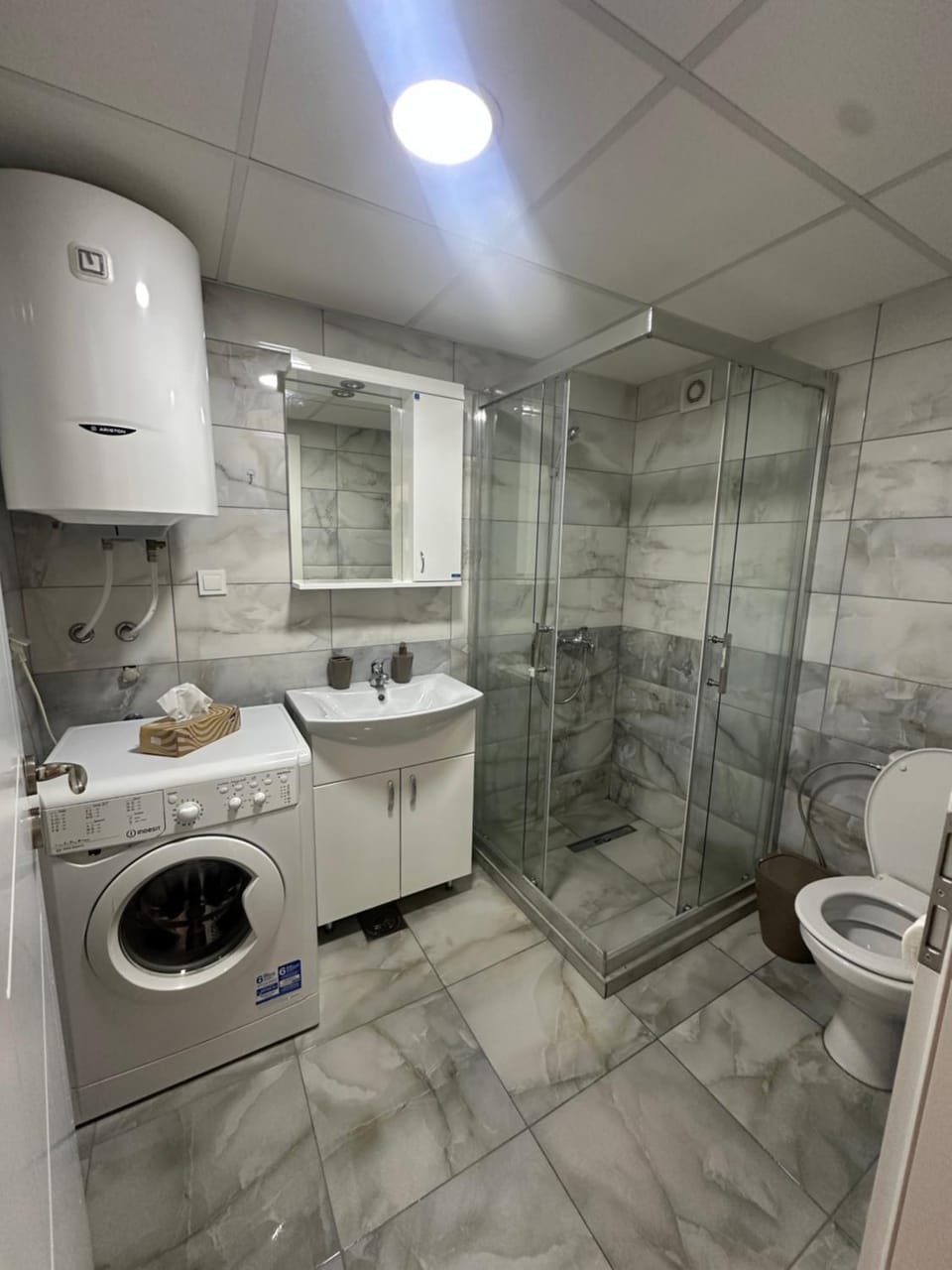 Toilet, Bathroom, towels, washing machine, dryer