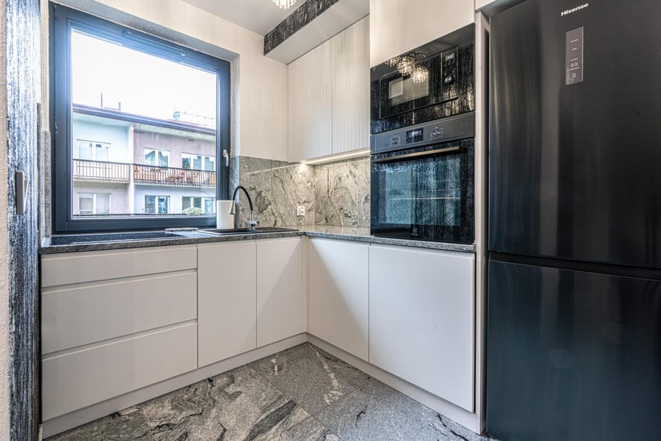 Kitchen or kitchenette, dishwasher, microwave, stove