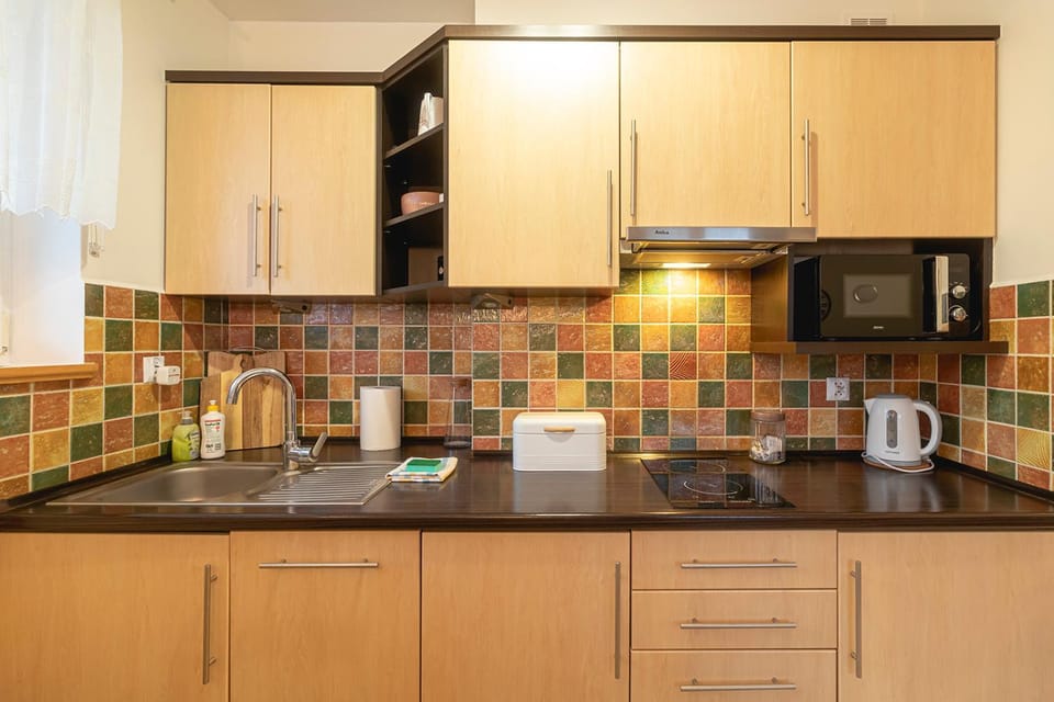 Kitchen or kitchenette, microwave, oven, stove, kitchen