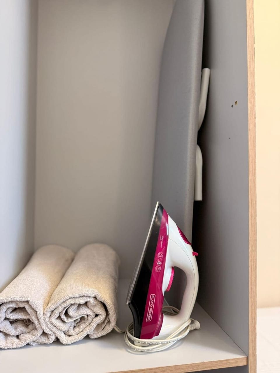 flat iron, towels, wardrobe
