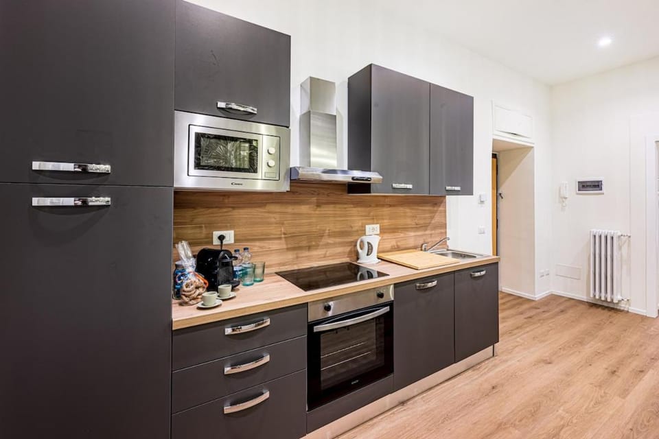 Kitchen or kitchenette, dishwasher, oven, stove