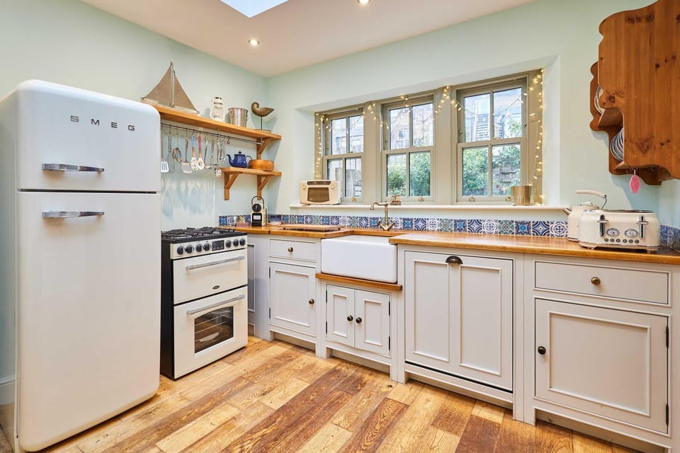 Kitchen or kitchenette, dishwasher, oven, stove, toaster