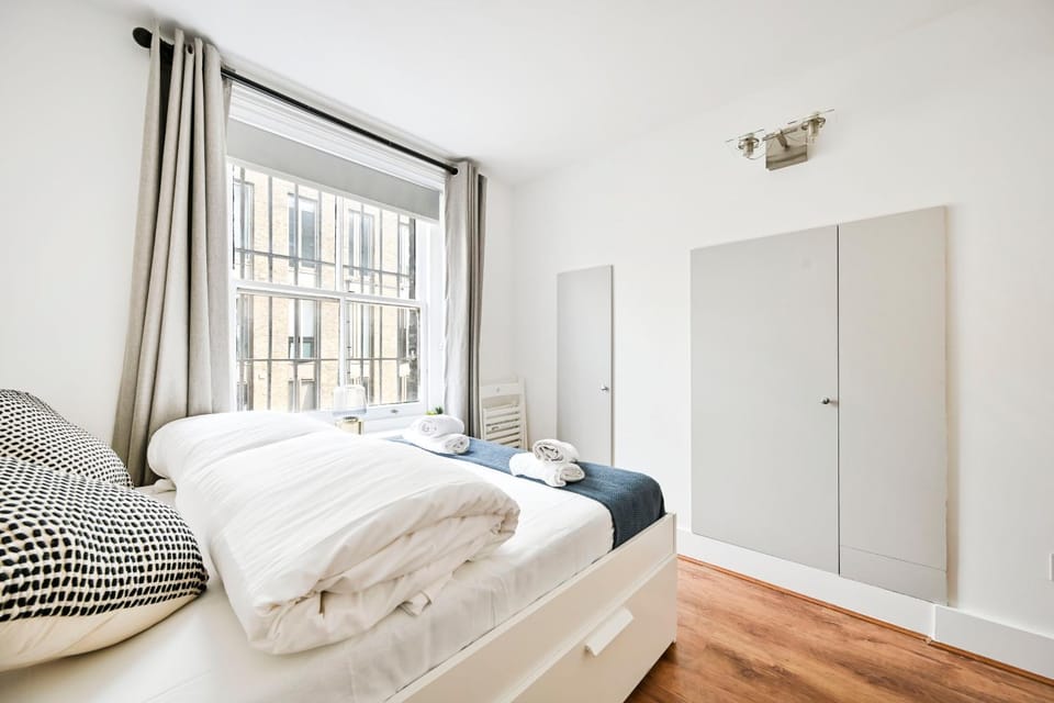 Bed, towels, wardrobe