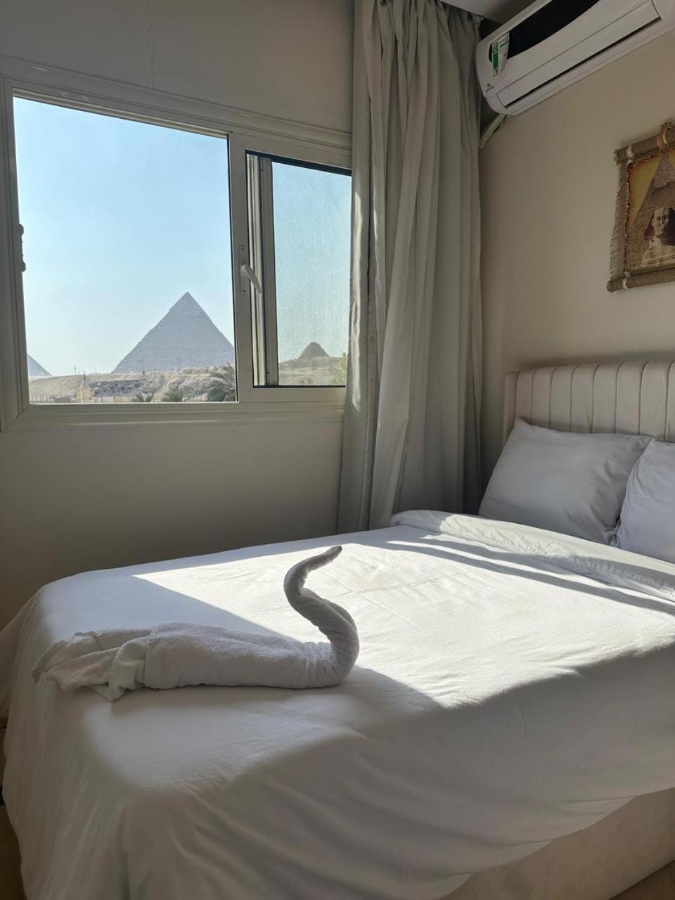 Bed, Bedroom, Landmark view, towels, air conditioner