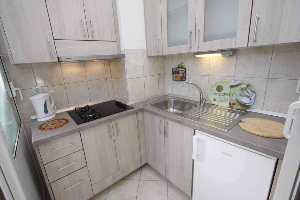 Kitchen or kitchenette, stove