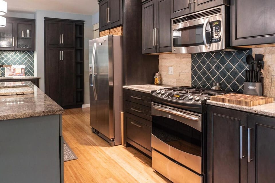 Kitchen or kitchenette, dishwasher, oven, stove