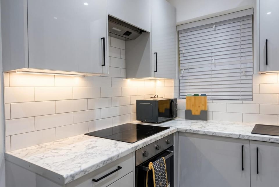 Kitchen or kitchenette, dishwasher, oven, stove, toaster