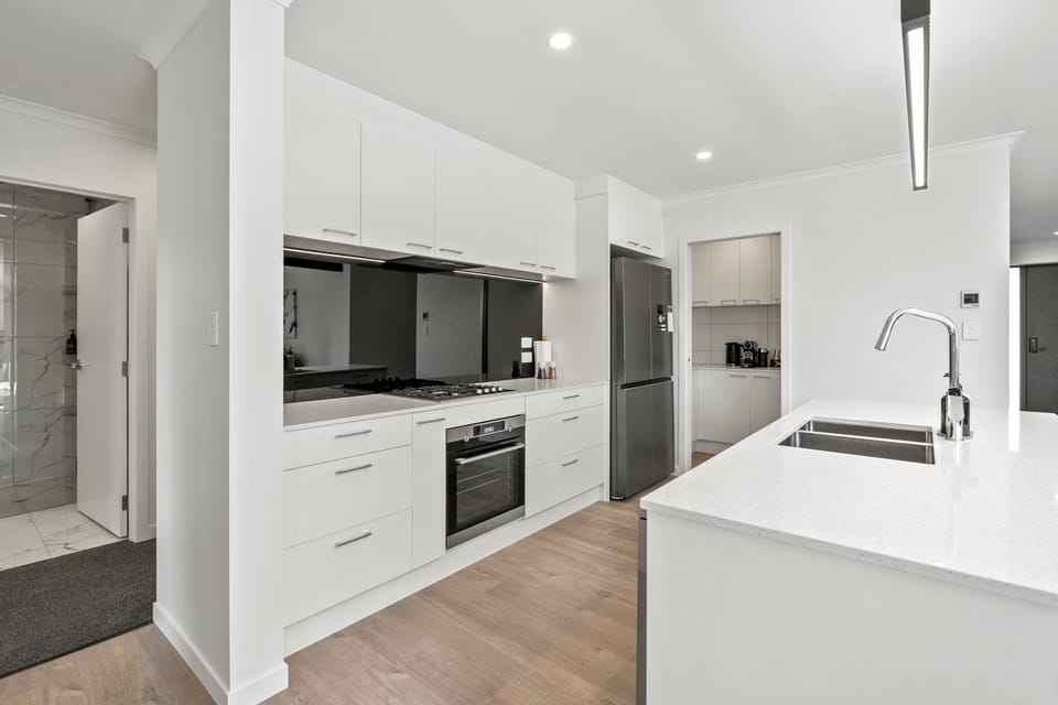 Kitchen or kitchenette, dishwasher, oven, stove