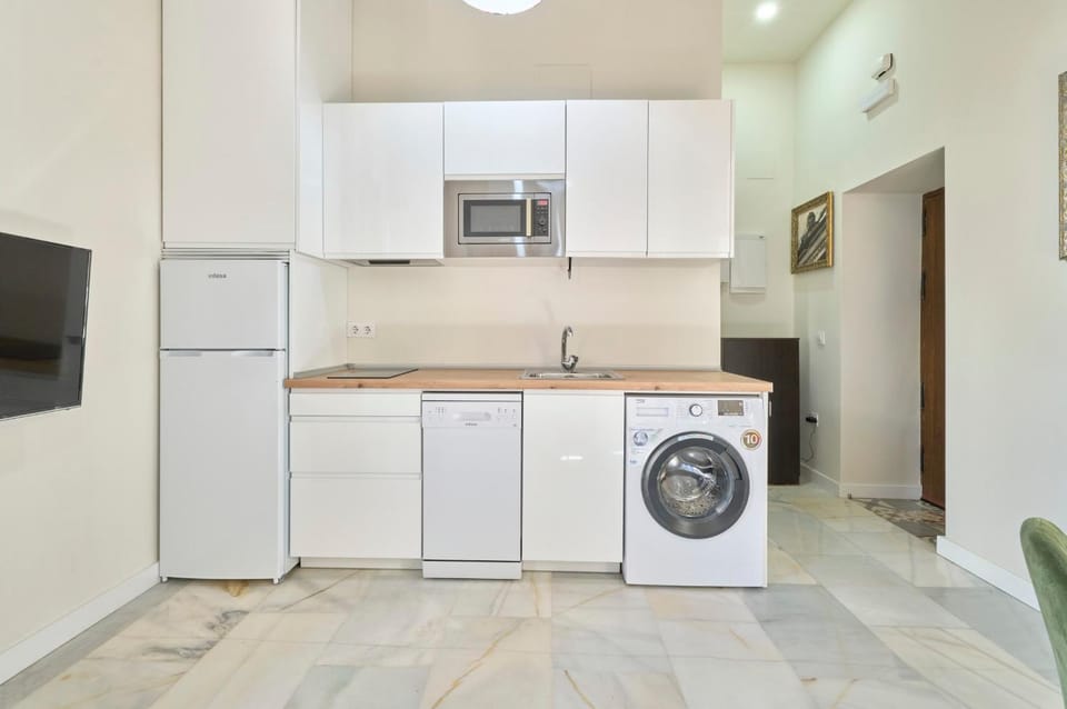 Kitchen or kitchenette, dishwasher, stove, washing machine