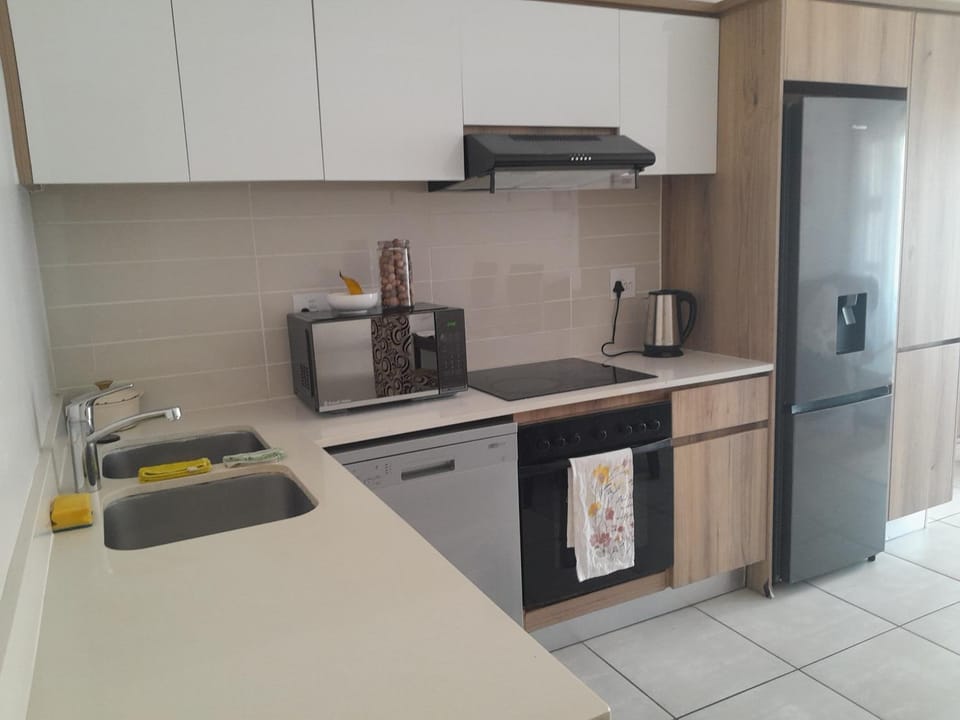Kitchen or kitchenette, dishwasher, oven, stove