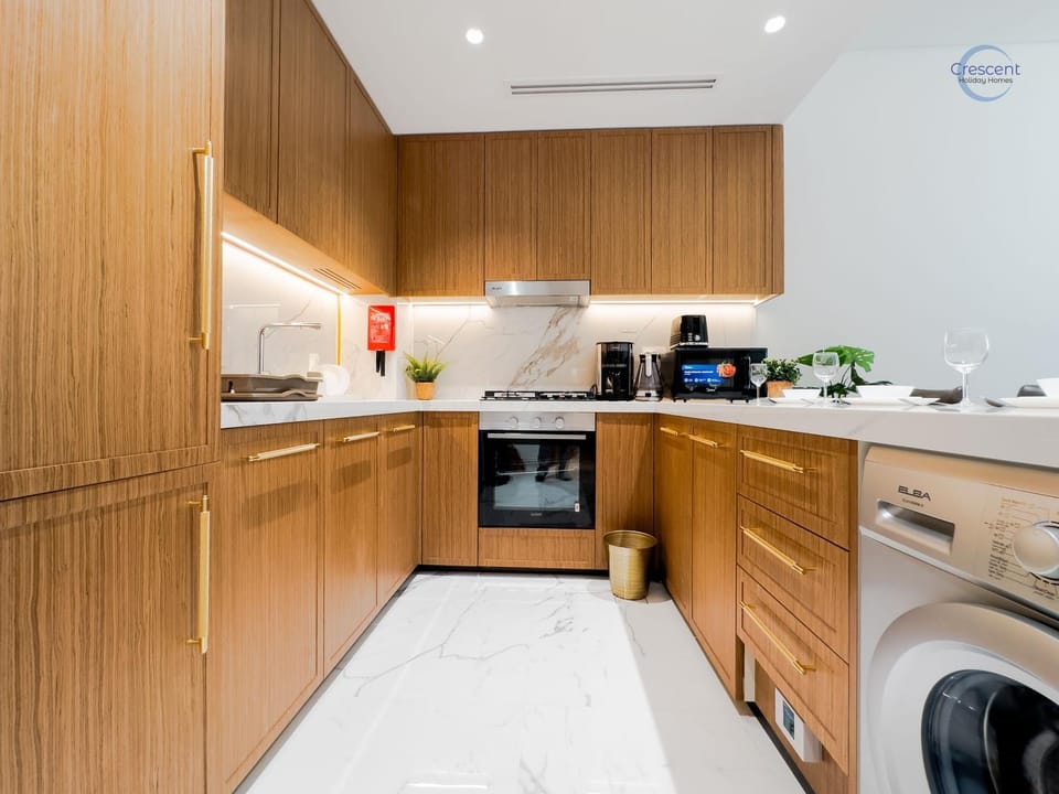 Kitchen or kitchenette, dishwasher, oven, stove, toaster, washing machine, dryer
