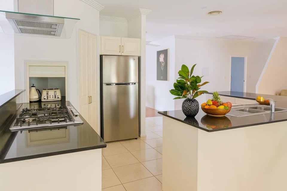 Kitchen or kitchenette, dishwasher, oven, stove
