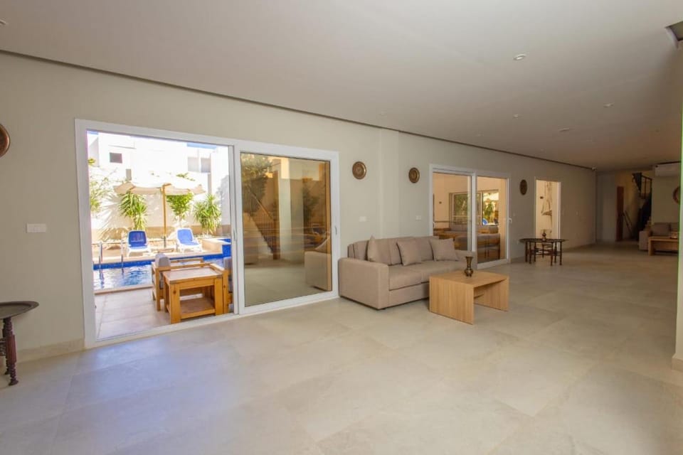 Patio, Living room, Seating area, Pool view, Swimming pool, sunbed