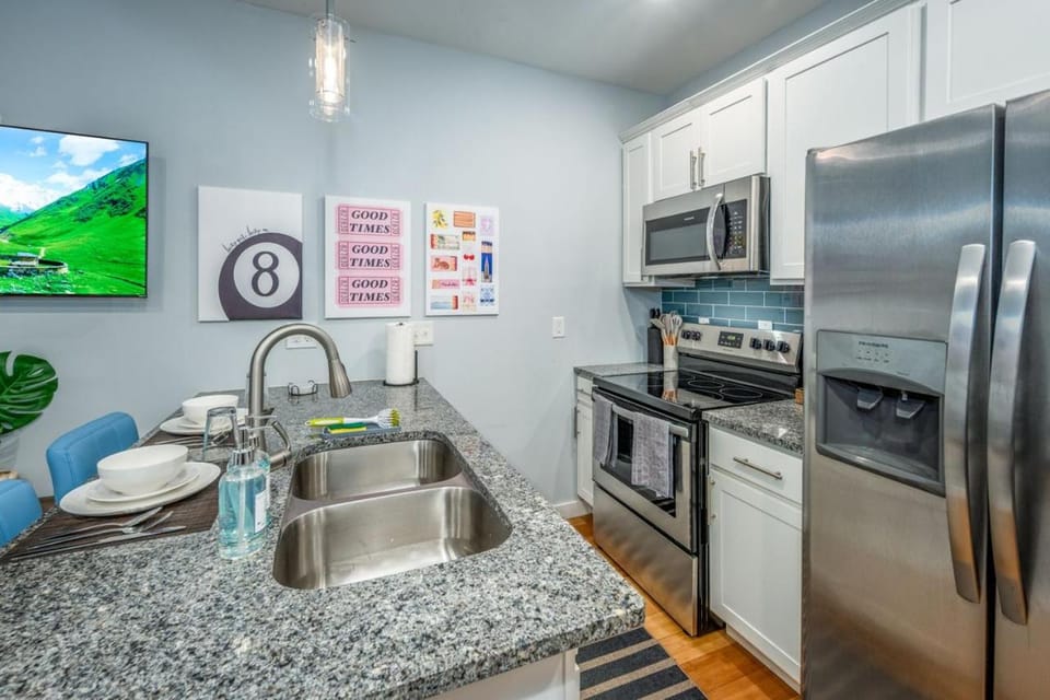 Kitchen or kitchenette, dishwasher, oven, stove
