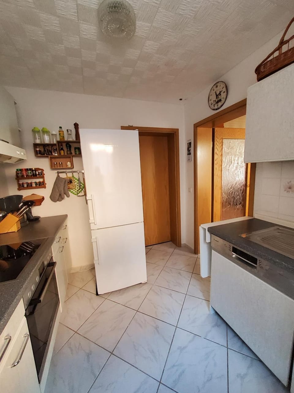 Kitchen or kitchenette, dishwasher, oven, stove