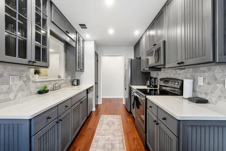Kitchen or kitchenette, dishwasher, oven, stove