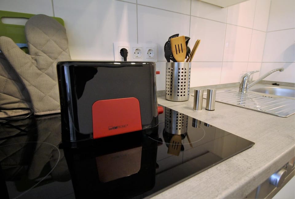 Kitchen or kitchenette, stove, toaster