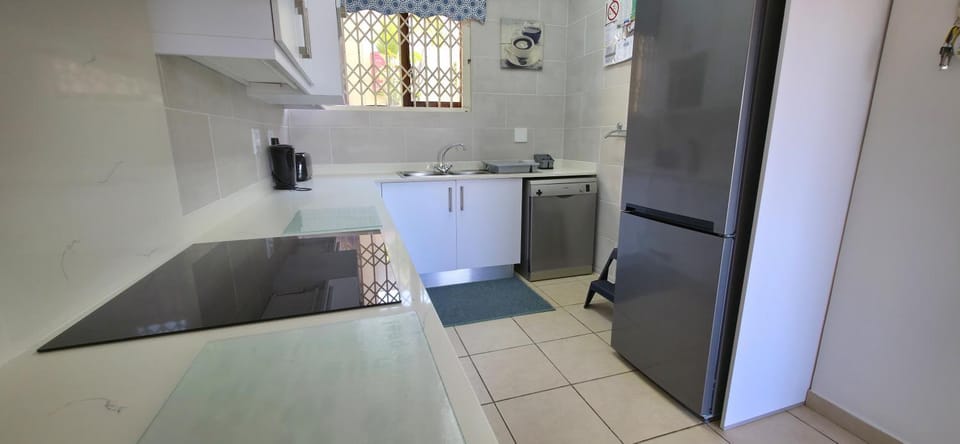 Kitchen or kitchenette, dishwasher, oven, stove