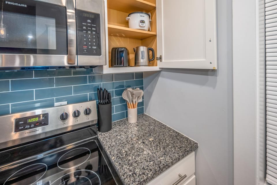 Kitchen or kitchenette, dishwasher, oven, stove, toaster