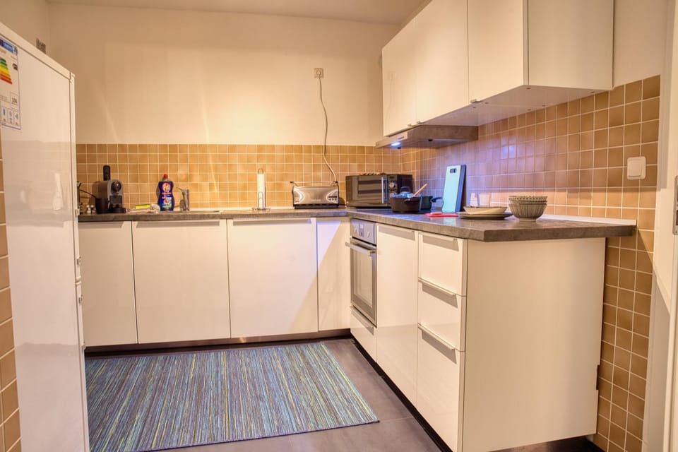 Kitchen or kitchenette, dishwasher, oven, stove, toaster