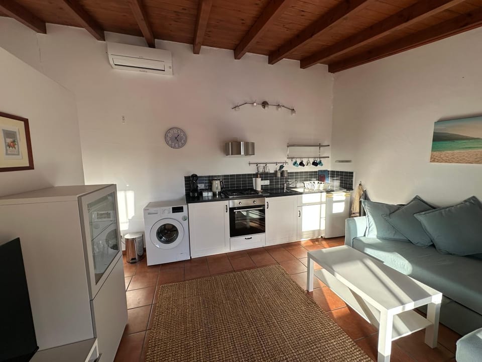 Kitchen or kitchenette, Living room, Dining area, oven, stove, toaster, washing machine, air conditioner