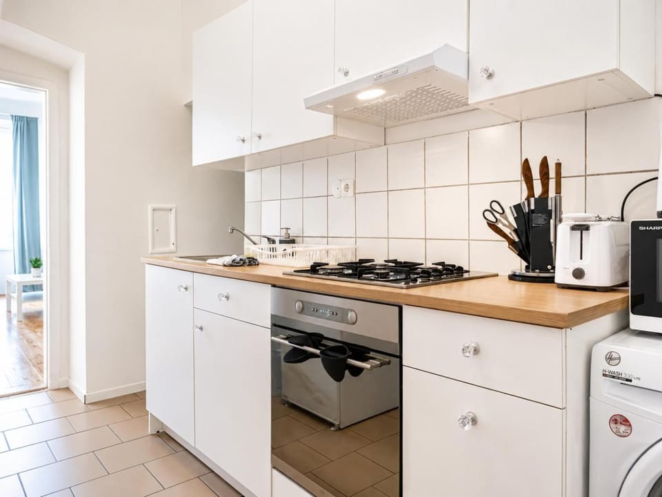 Kitchen or kitchenette, stove, toaster, washing machine