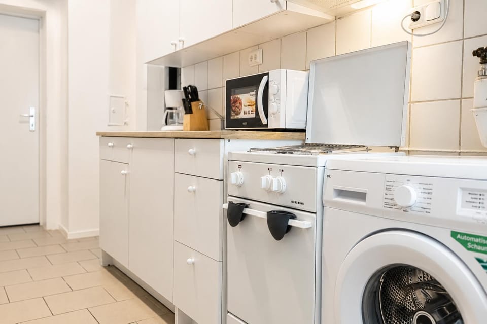 Kitchen or kitchenette, stove, washing machine