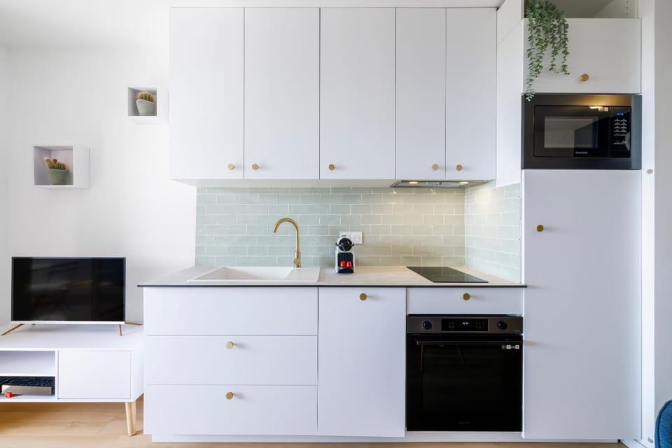 Kitchen or kitchenette, dishwasher, oven, stove