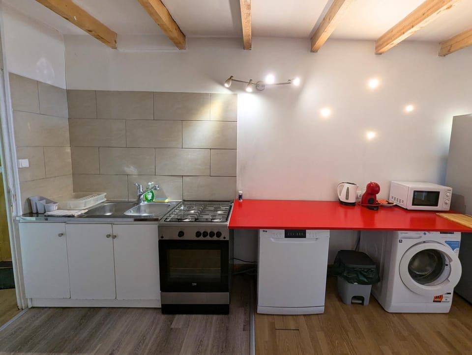 Kitchen or kitchenette, dishwasher, oven, stove, washing machine